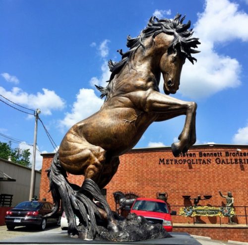bronze jumping horse statue